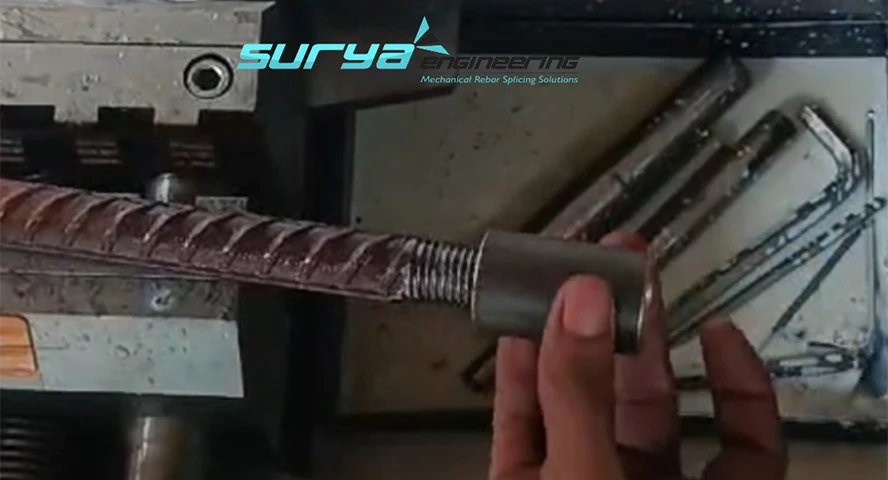 Surya Engineering technician performing thread engagement and pitch inspection on parallel-threaded TMT bar